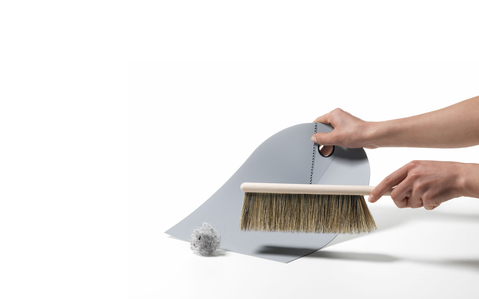 Dustpan lightgrey function action with hand and broom