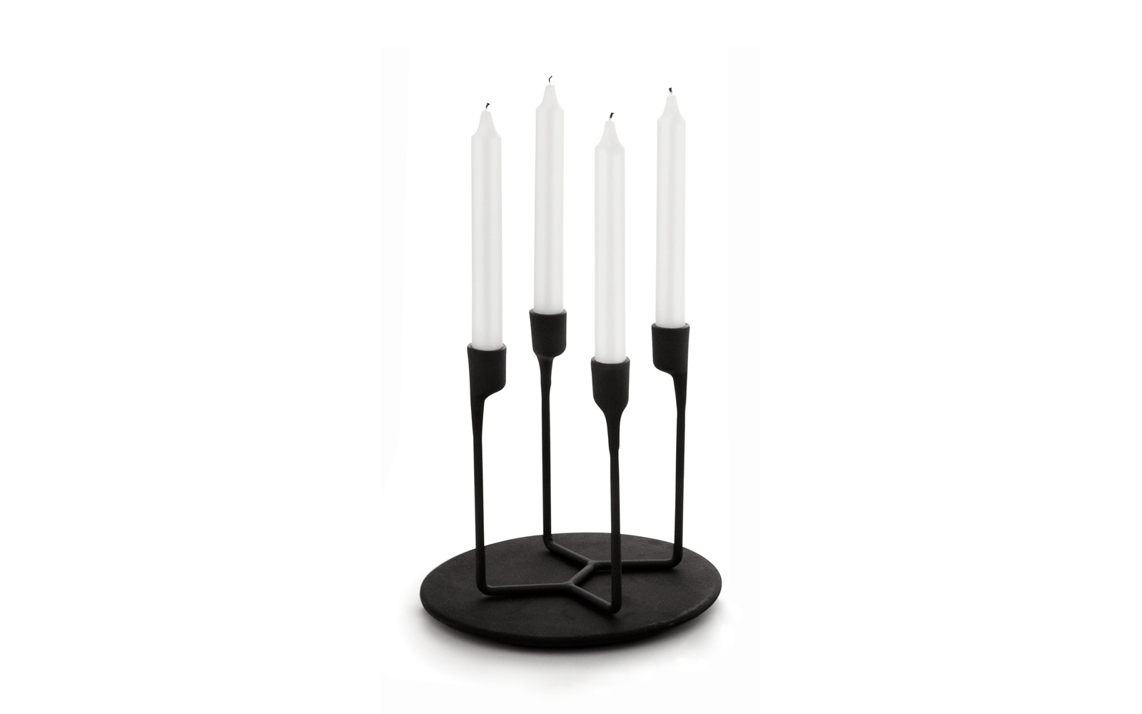 Heima castiron black 4 armed candlestick function sideview on heima plate