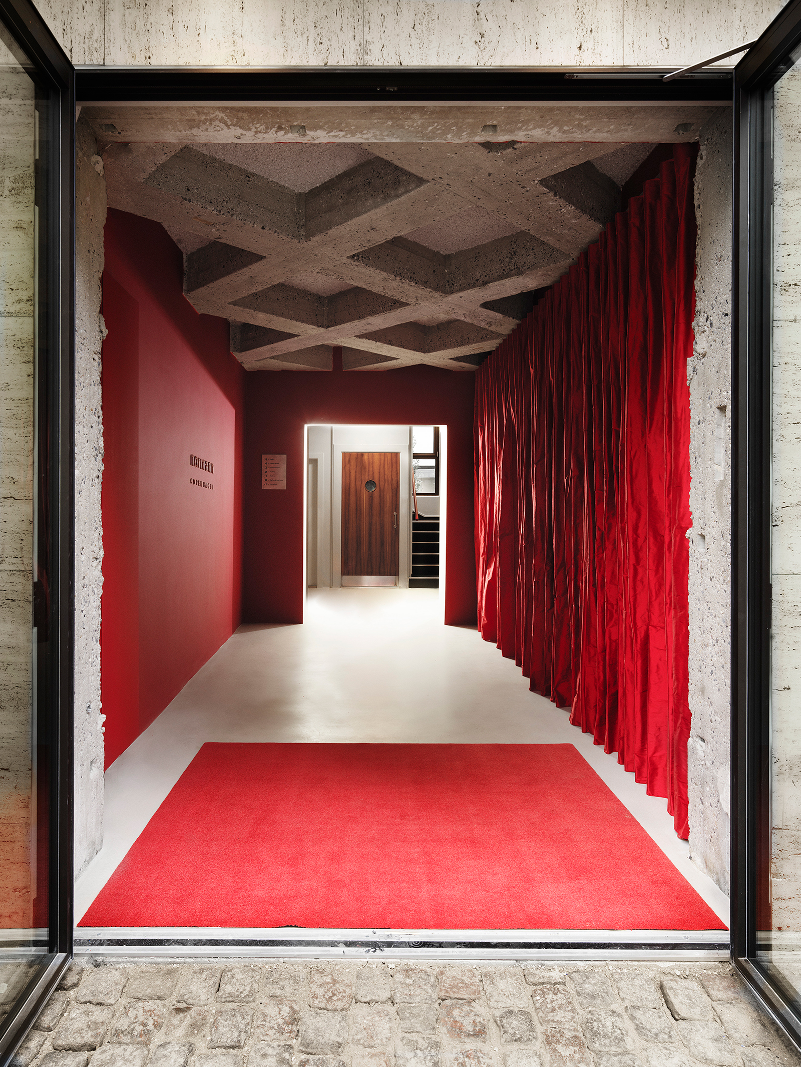 Normann HQ red vestibule entrance