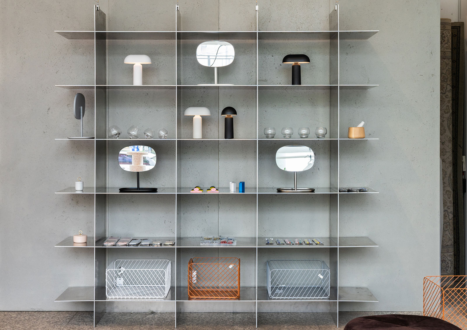 Steel shelves with Normann Copenhagen products