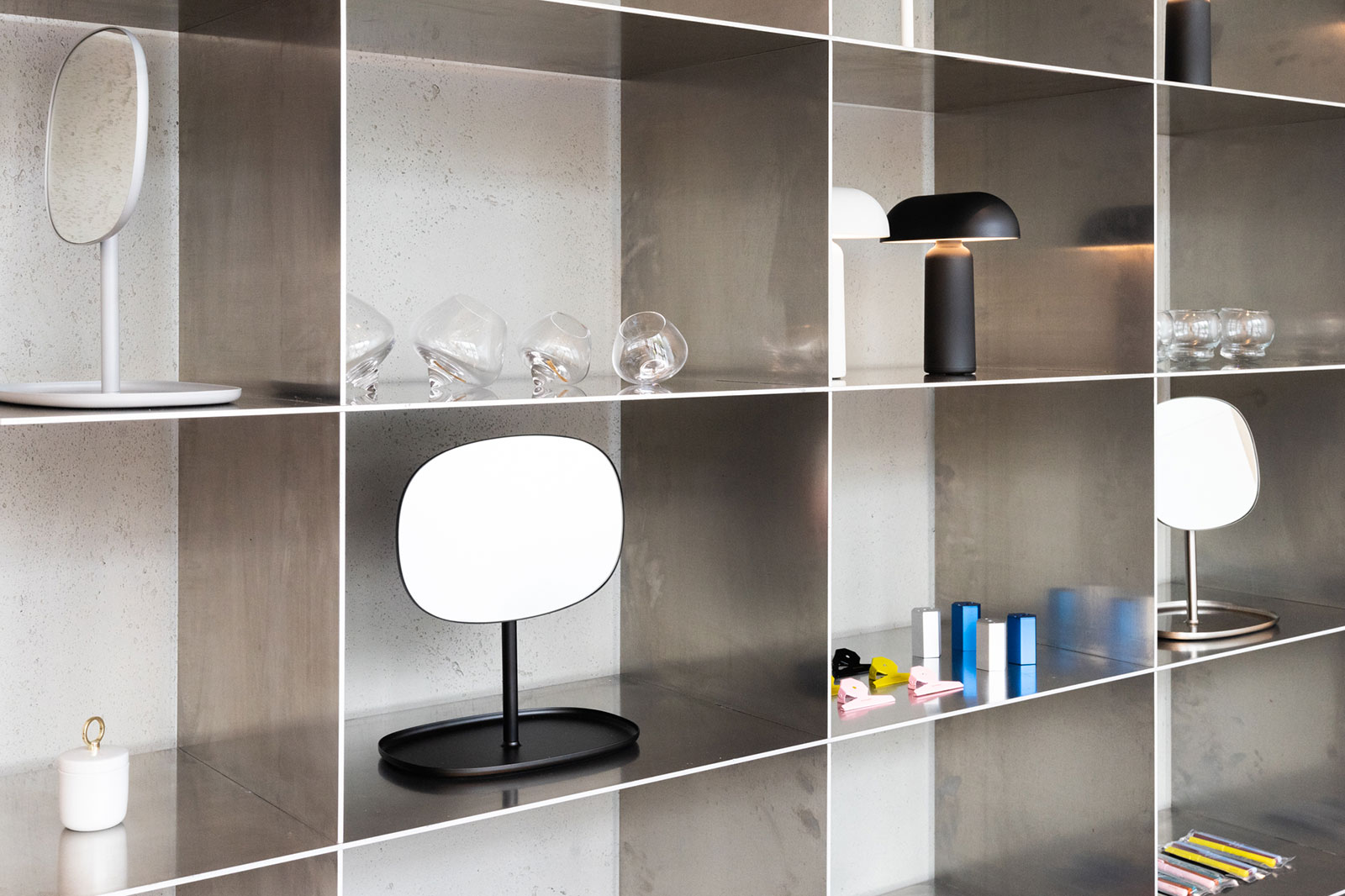 Steel shelves with Normann Copenhagen products
